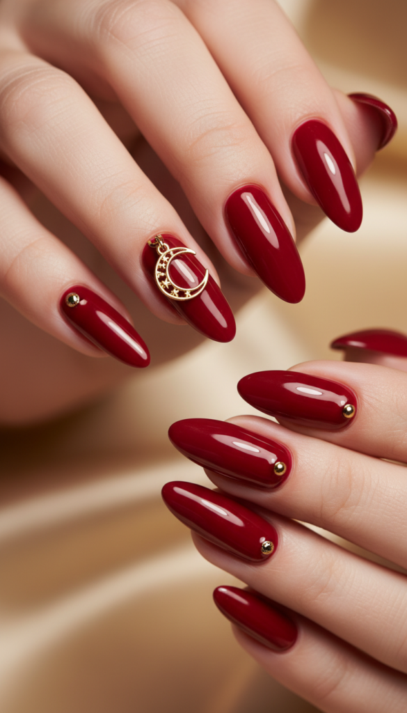 9. Red Stiletto Pierced Nails With Dramatic Gold Charms