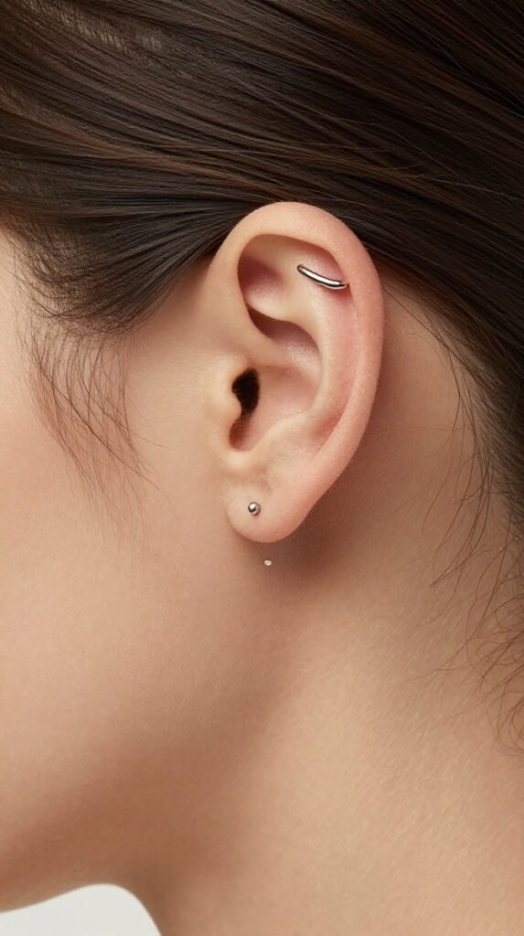 13. Anti-Tragus Ear Piercing With A Petite Curved Bar