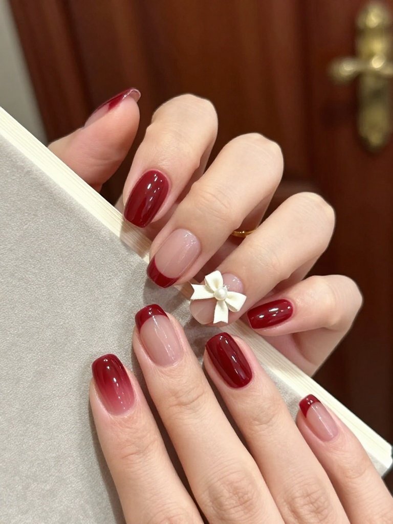 Wedding Nails Designs With Burgundy and an Ivory Bow
