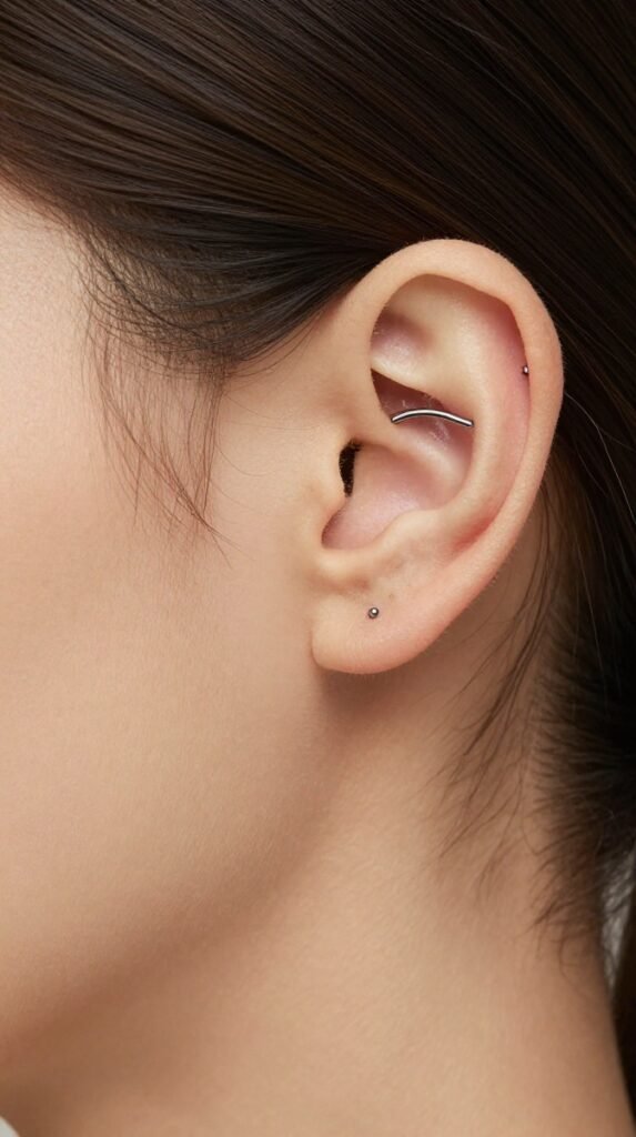 14. Rook Ear Piercing With A Delicate Curved Barbell