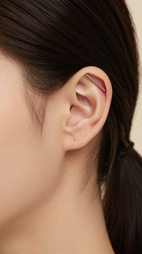 17. Industrial Ear Piercing With A Slim Straight Bar
