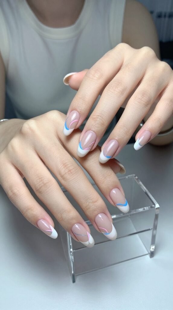 Pink and Blue French Tip Nails: 18 High-Quality Designs Worth Saving 8 8. Pink and Blue French Tip Nails With Abstract Swirl Lines
